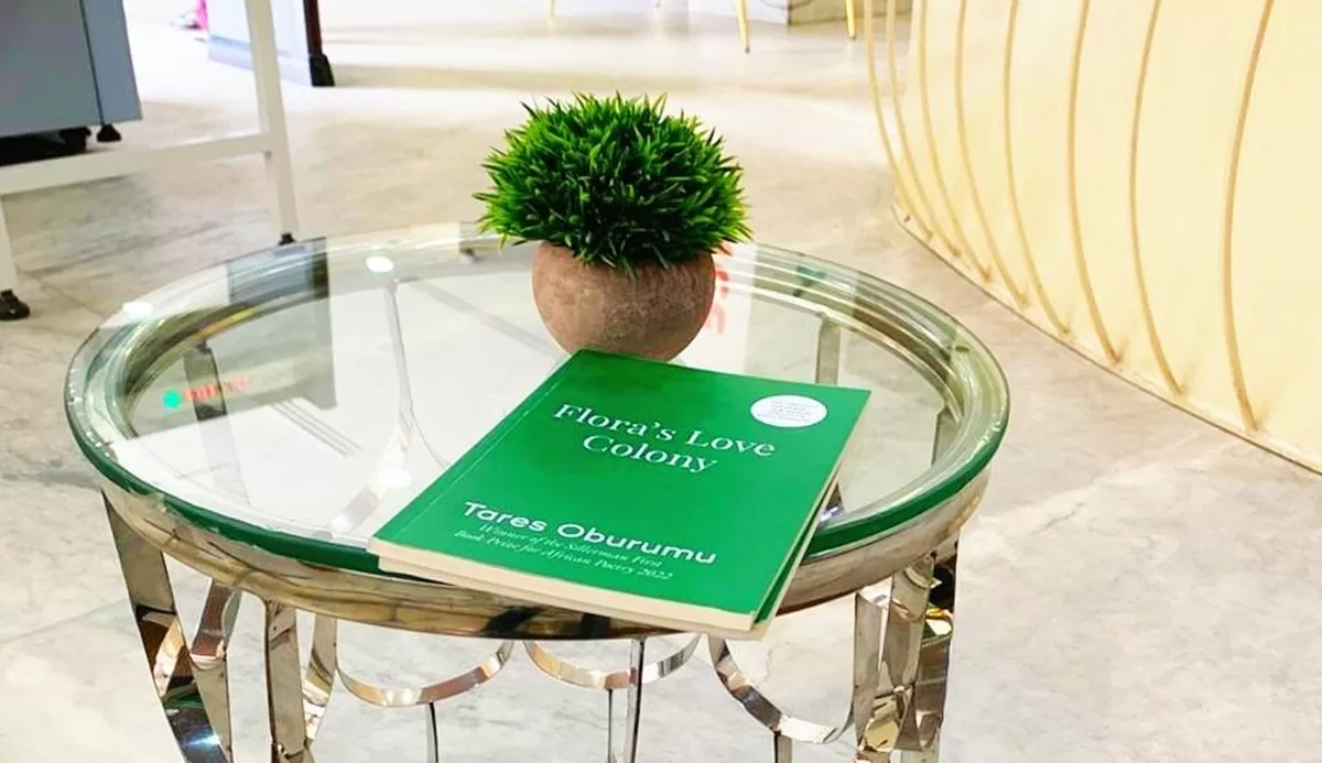 SATIRE AND SEED: THE UNENDING BLOOM OF COLONIALISM | A Review of Tares Oburumu’s ‘Flora’s Love Colony’